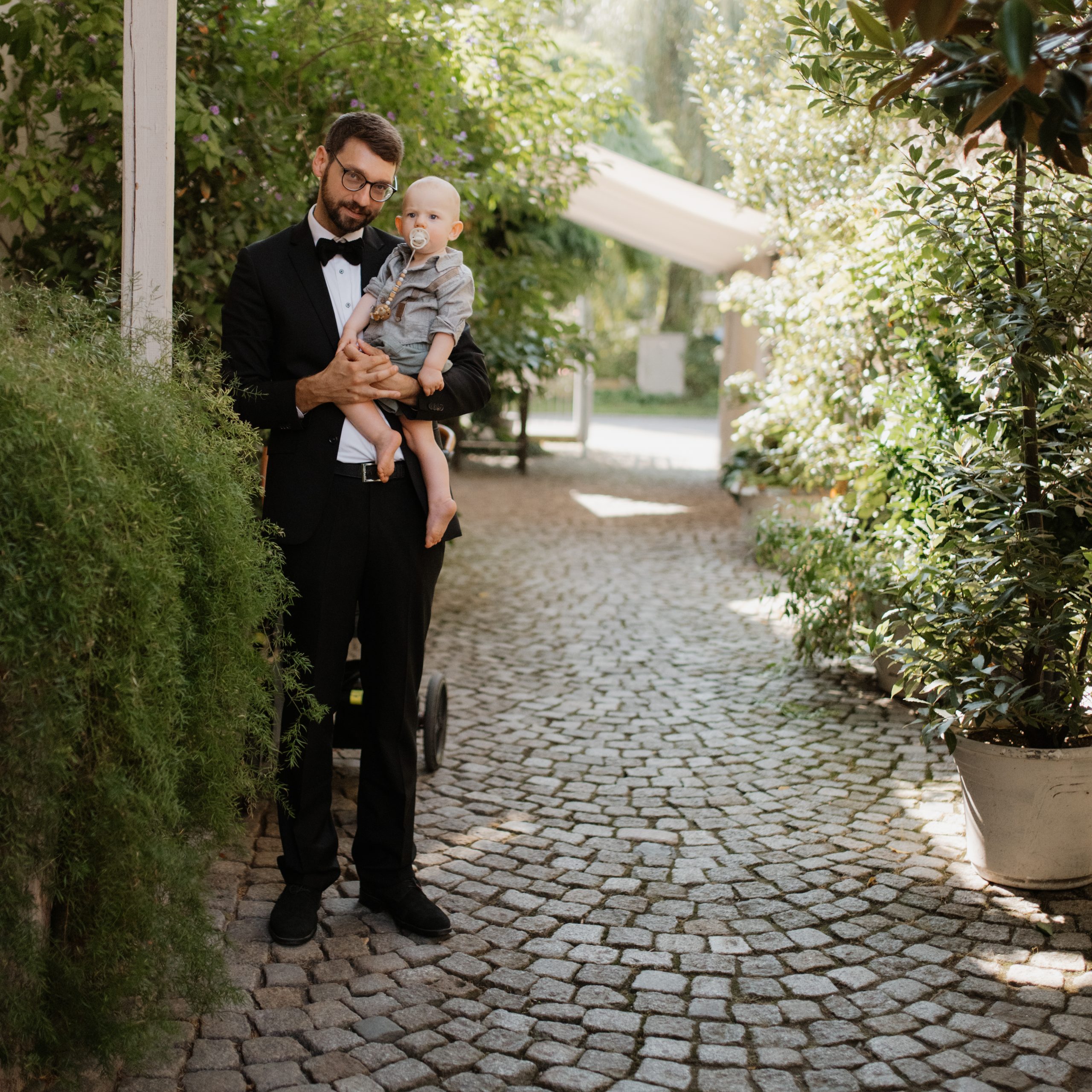 wedding guest holding kid