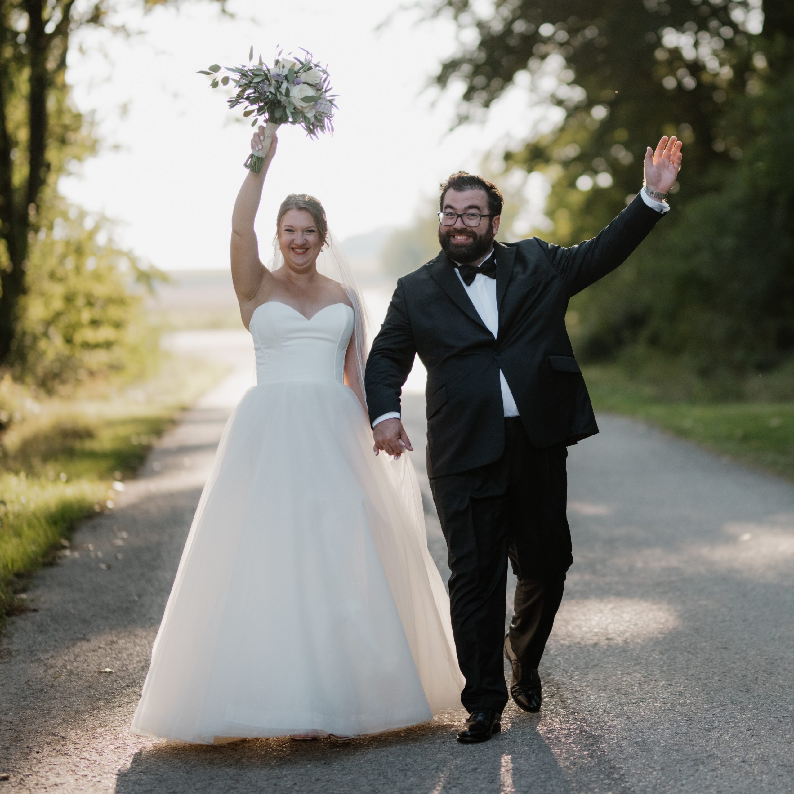 bride and groom walking on street