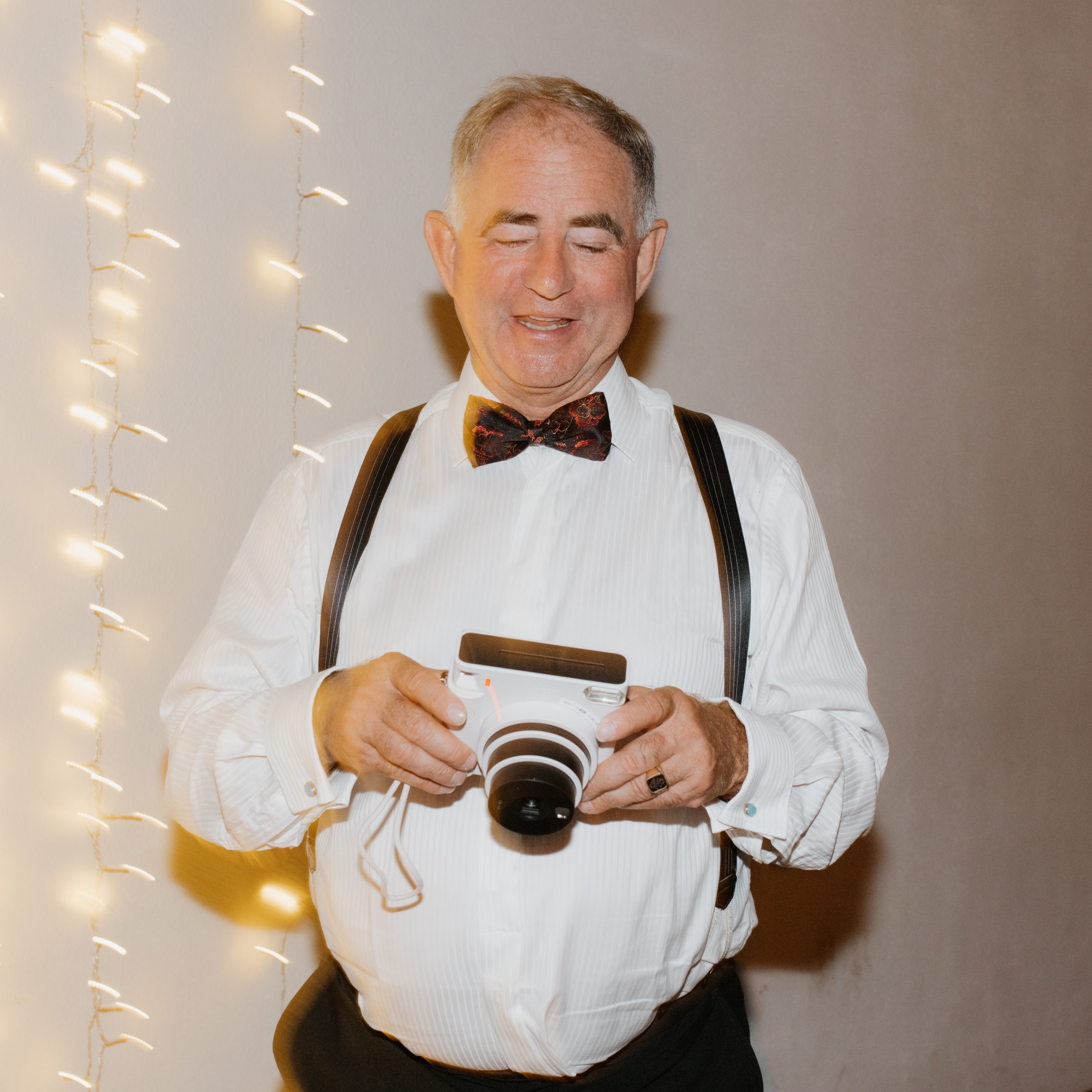 wedding guests with polaroid camera