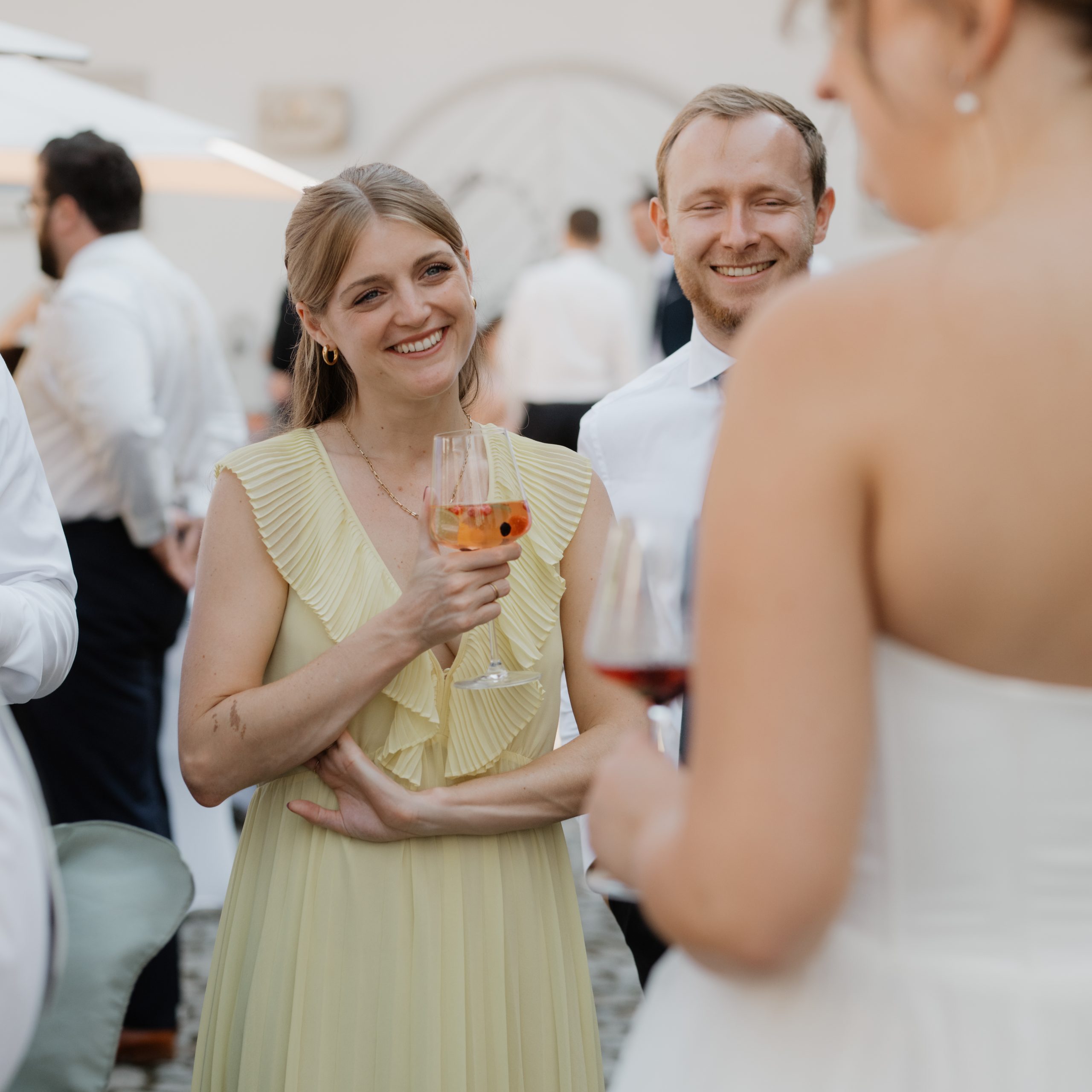 wedding guests listening to bride