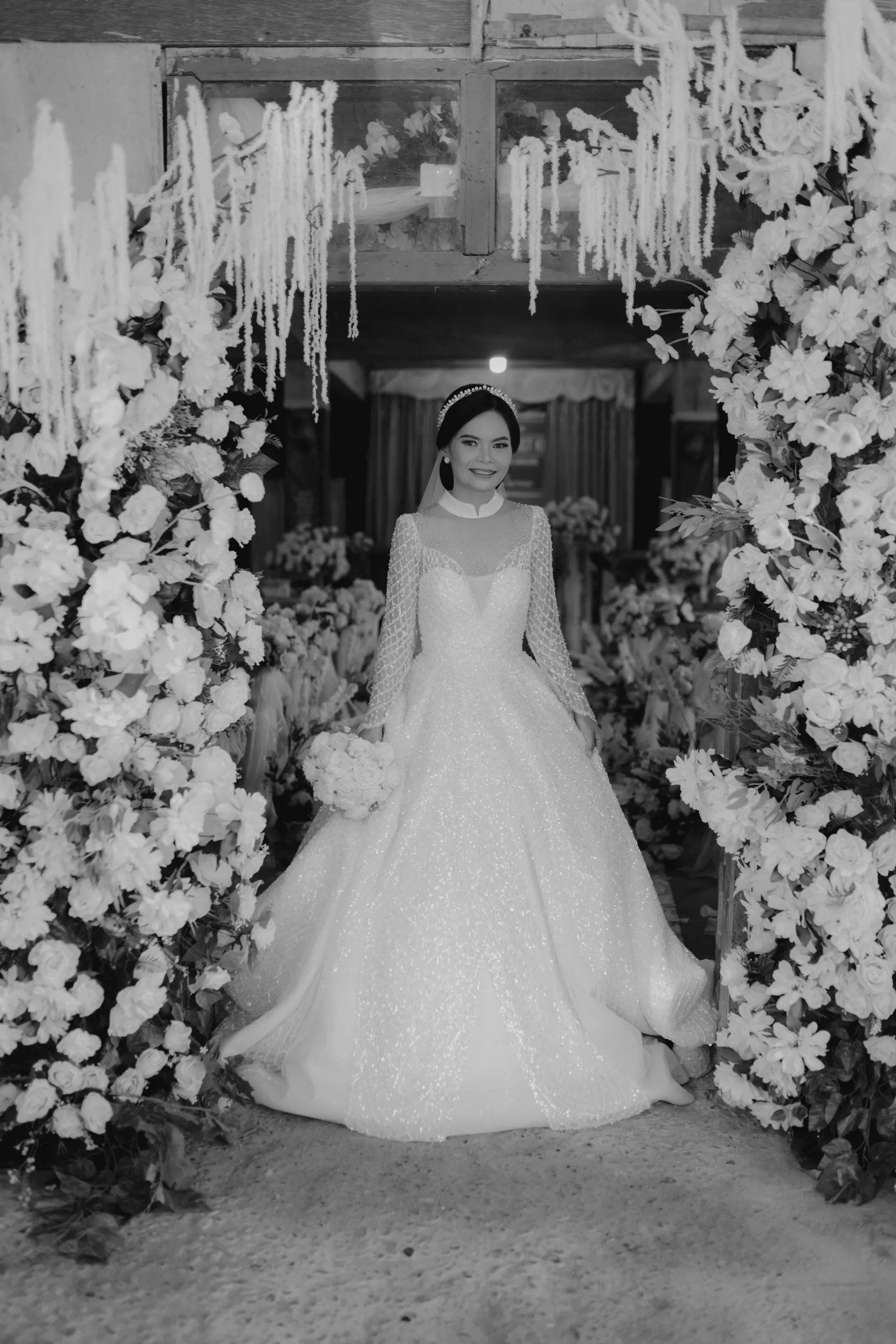 Indonesian bride in between flowers