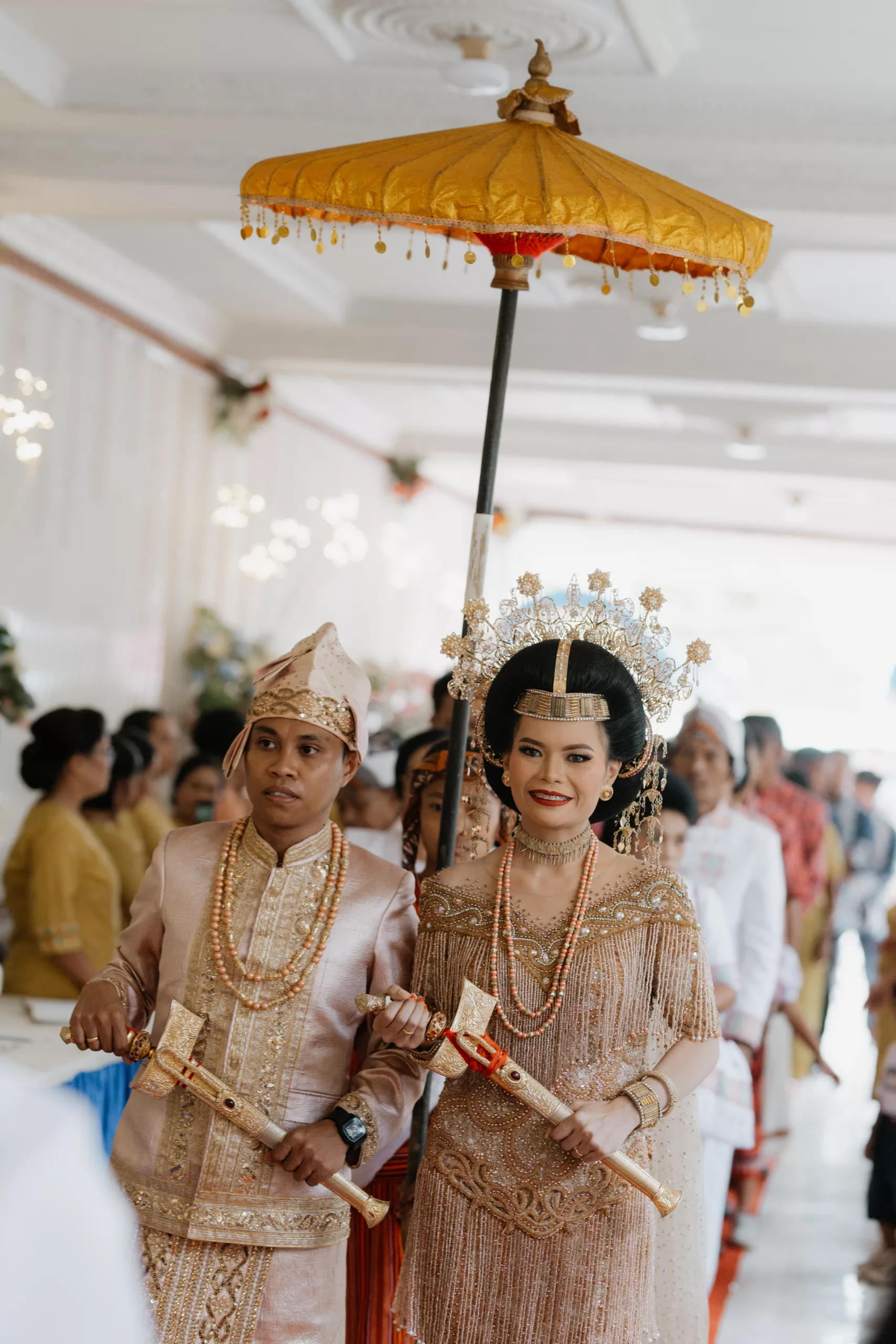 traditional indonesian wedding ceremony, indonesian couple walking in